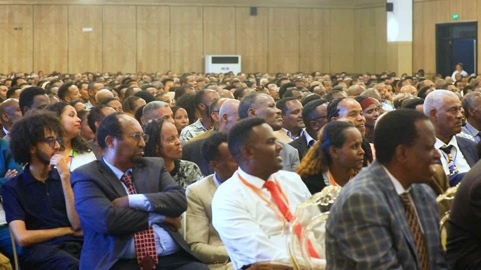 Participants listening during a training session.